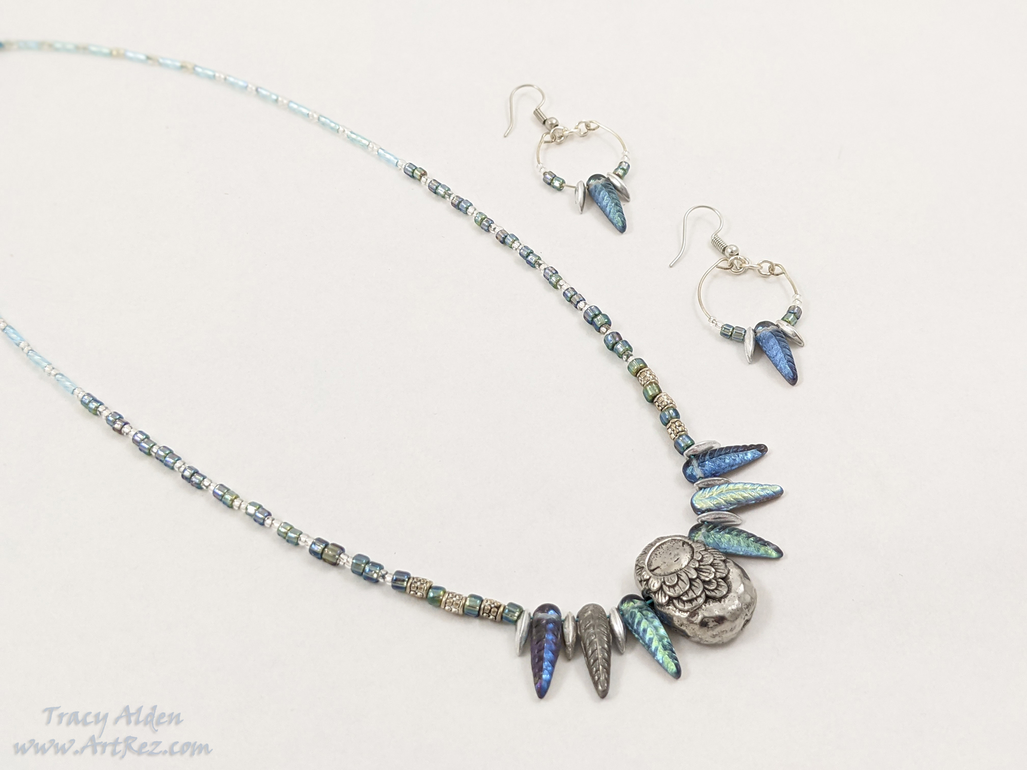 Silver, grey and blue necklace set made with beads from Allegory Gallery 