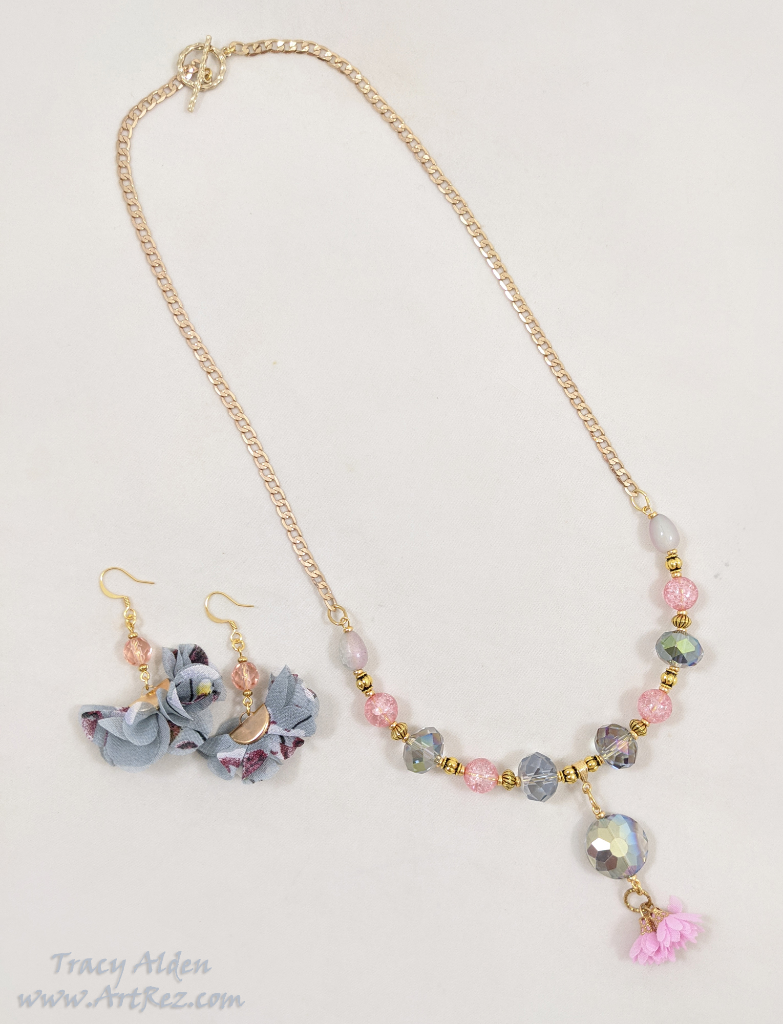 A soft grey and pink necklace set using Jesse James Beads