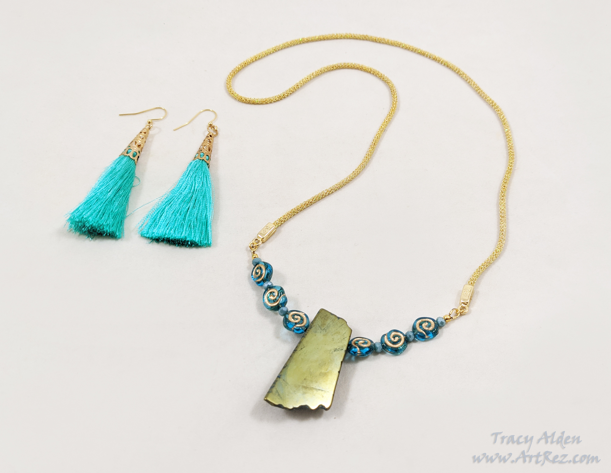 A teal and gold necklace set using supplies from SilverSilk